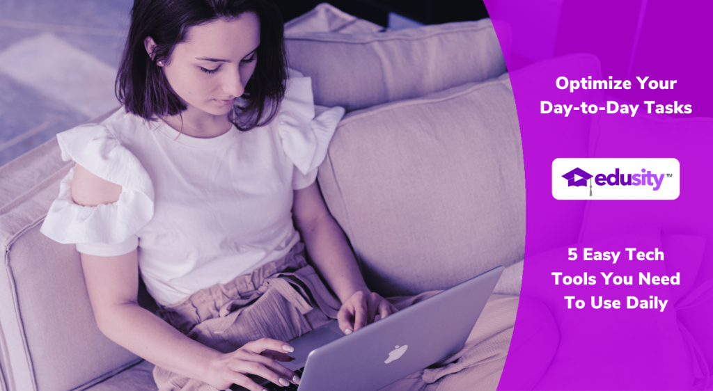 Image of young woman sitting indoors on a couch working on her laptop.